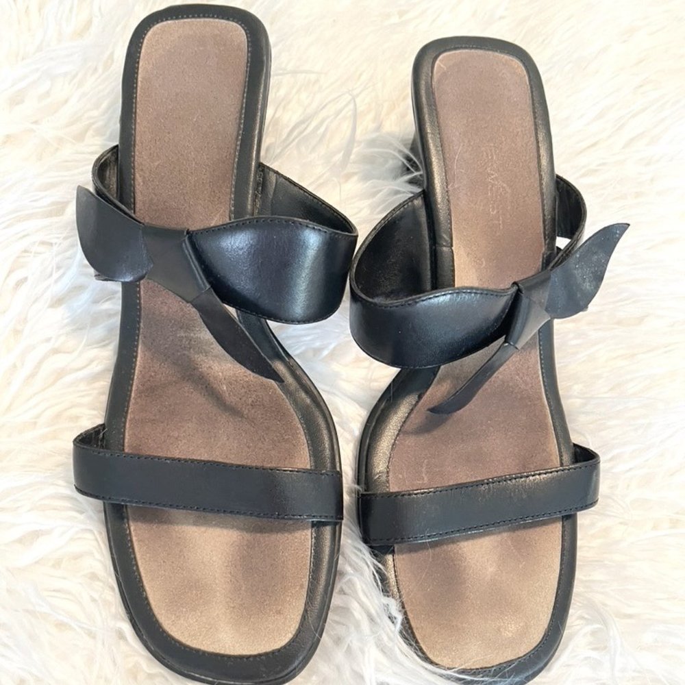 Slip on contemporary black leather heeled sandals
